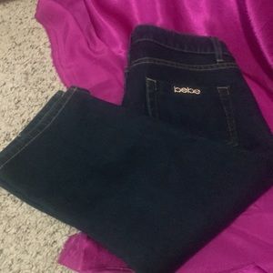 Bebe three-quarter length dark denim jeans made n USA size 30 amazing quy